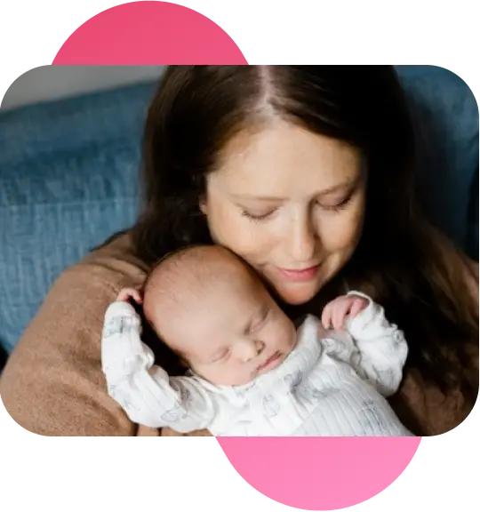 A woman holding a baby