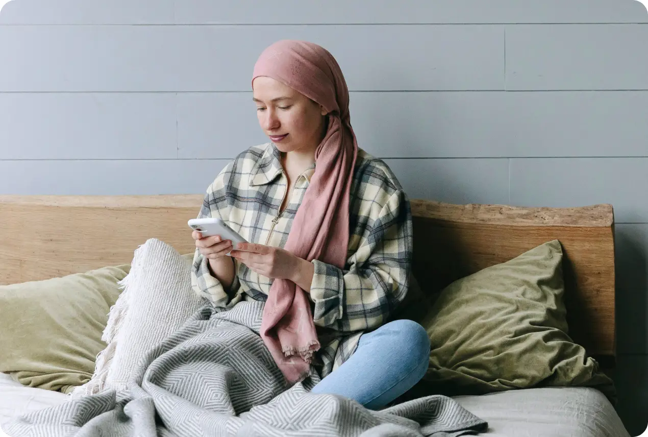 Woman sitting looking at her phone